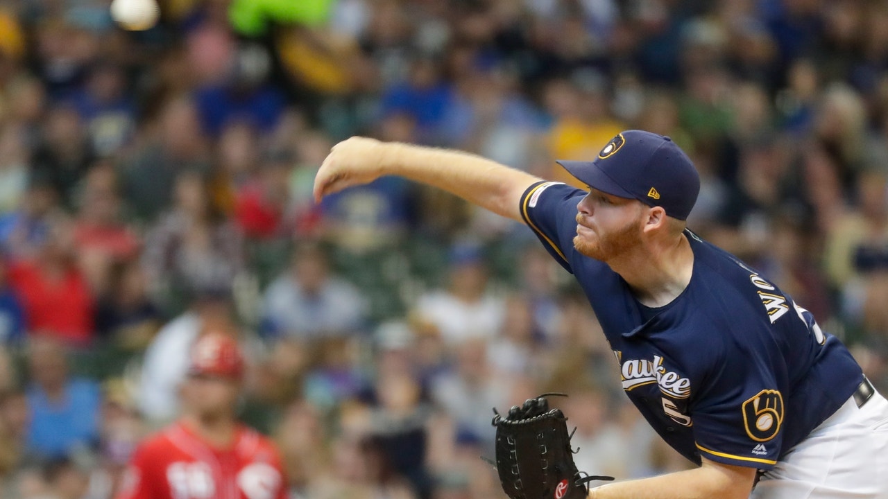 Woodruff strikes out career-high 12, Brewers beat Reds 7-5
